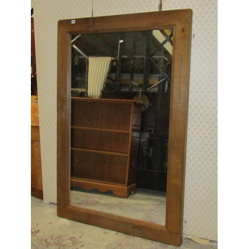 2592 - An oak framed mirror with pegged finish, 150cm x 1m