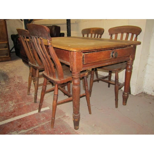 2597 - A Victorian scrubbed pine kitchen table, 120cm x 80cm, together with four Windsor kitchen chairs wit... 