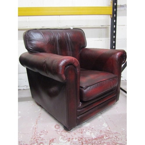 2598 - A Thomas Lloyd traditional tub or library chair in a dark maroon finish