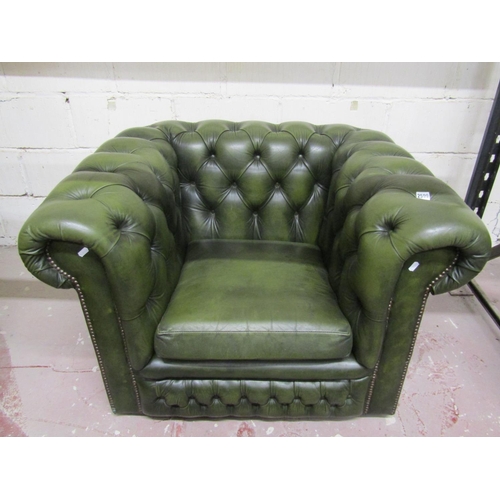 2599 - A Chesterfield chair with deep button finish in mid-green leather upholstery