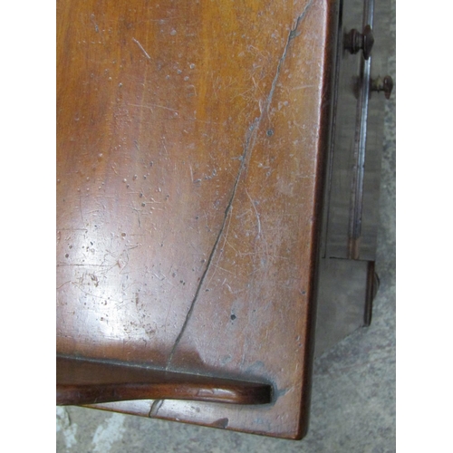 2602 - A mid-Victorian mahogany side table, the central kneehole surrounded by an arrangement of seven draw... 