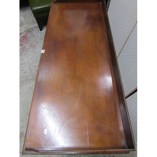 2602 - A mid-Victorian mahogany side table, the central kneehole surrounded by an arrangement of seven draw... 