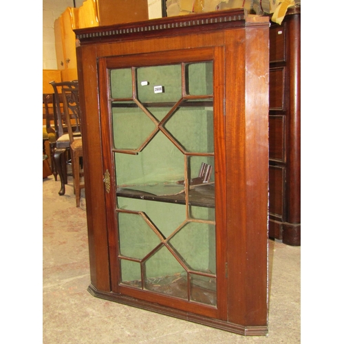 2608 - A 19th century mahogany hanging corner cupboard with astragal glazed panelled door (af)