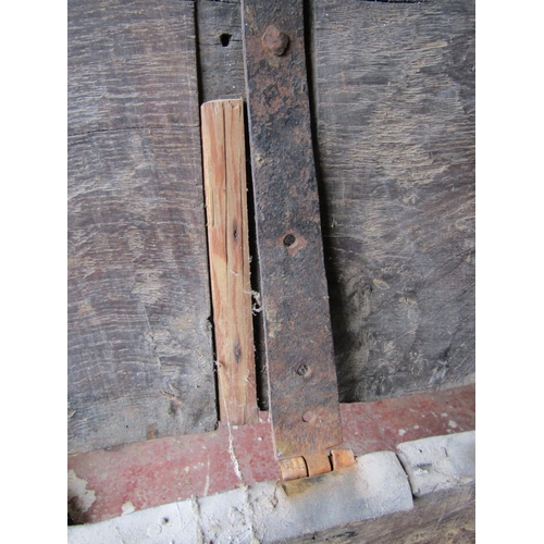 2614 - A very early English oak boarded panelled coffer, with nail and steel banded supports, 175cm long x ... 