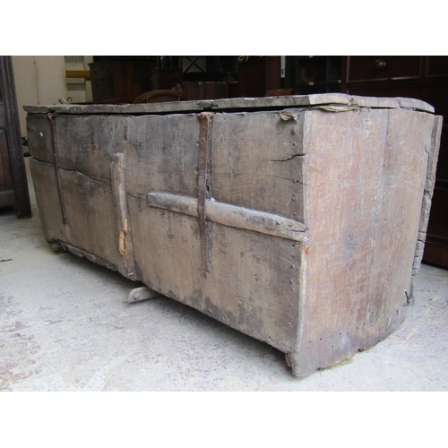 2614 - A very early English oak boarded panelled coffer, with nail and steel banded supports, 175cm long x ... 