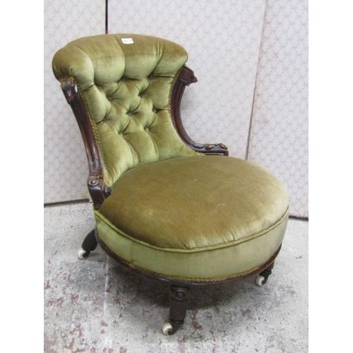 2619 - A Victorian low occasional/bedroom chair with upholstered seat and button back within a showwood fra... 