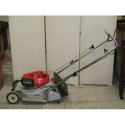 2621 - A Honda HR173 petrol driven rotary lawn mower with rear roller, complete with grass collection bag