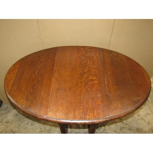 2429 - A small 1920's oak drop leaf barley twist gateleg table together with a further barley twist standar... 