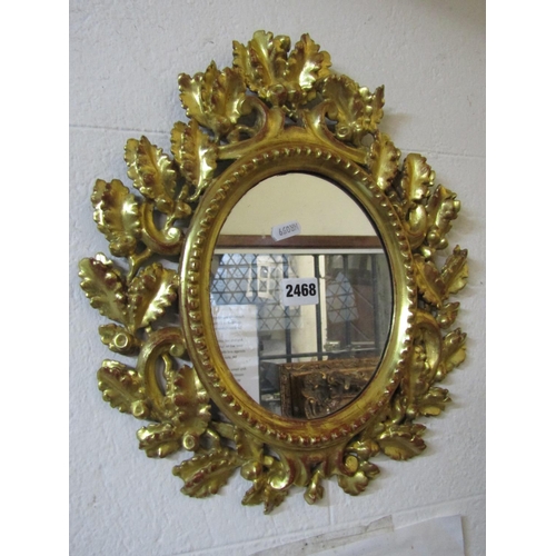 2468 - A small 19th century Florentine wall mirror of oval form with repeating oakleaf and acorn surround 4... 