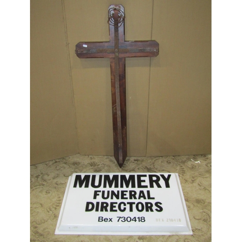 2500 - A stained hardwood church cross with iron fittings together with a funeral directors sign (2)