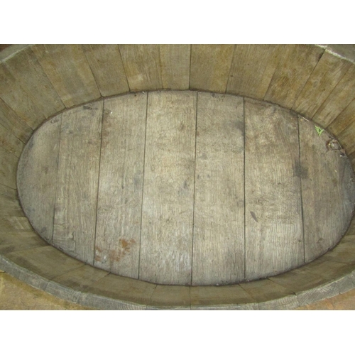 2779 - A coopered oak and steel banded oval tub 94cm x 61cm x 45cm (full height)