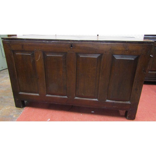 2774 - A Georgian oak panelled coffer, the front enclosed by four fielded panels beneath a plank top, 122cm... 