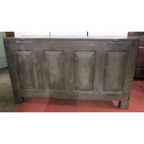 2774 - A Georgian oak panelled coffer, the front enclosed by four fielded panels beneath a plank top, 122cm... 