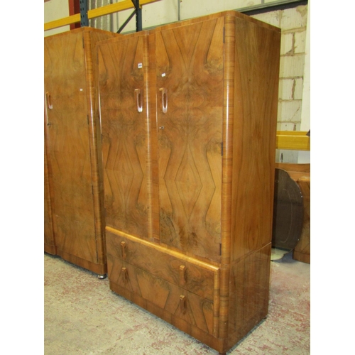 2606 - An art deco figured walnut bedroom suite comprising a large wardrobe a smaller example, a double bed... 