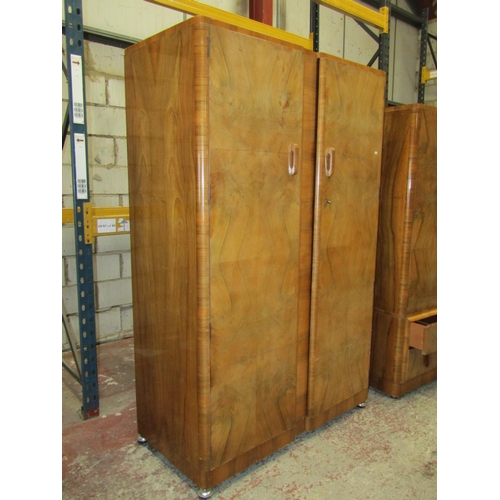 2606 - An art deco figured walnut bedroom suite comprising a large wardrobe a smaller example, a double bed... 