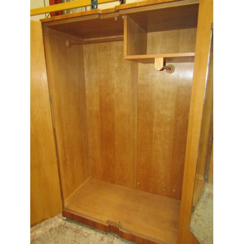 2606 - An art deco figured walnut bedroom suite comprising a large wardrobe a smaller example, a double bed... 