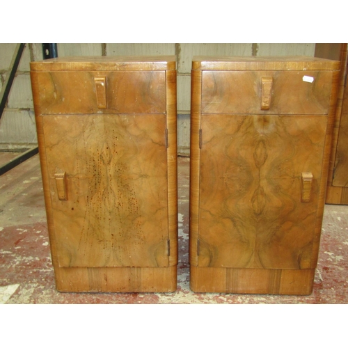 2606 - An art deco figured walnut bedroom suite comprising a large wardrobe a smaller example, a double bed... 