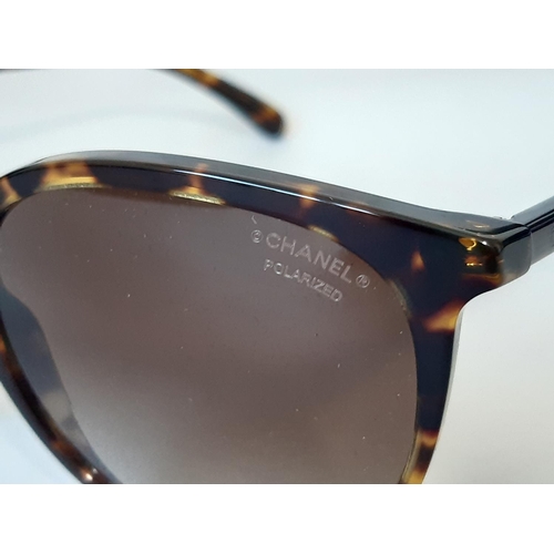 1625 - One pair sunglasses by Chanel, unused in black leather case, with booklet, Chanel sealed cleaning cl... 