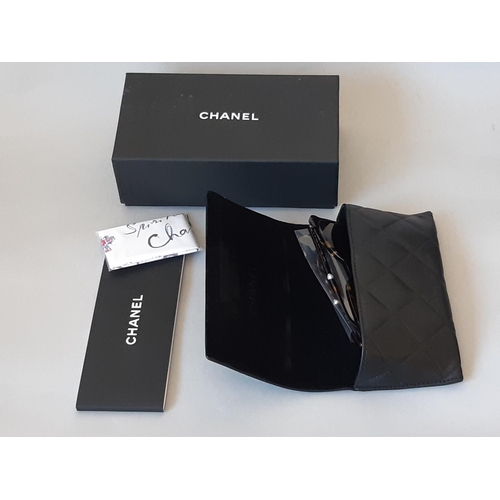 1625 - One pair sunglasses by Chanel, unused in black leather case, with booklet, Chanel sealed cleaning cl... 