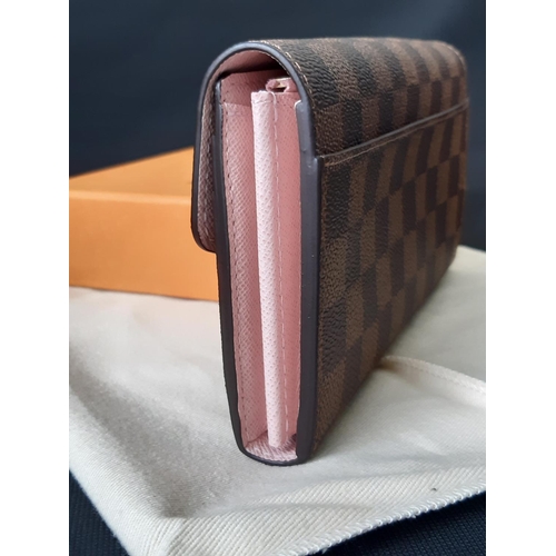 1627 - 'Sarah' wallet by Louis Vuitton (current style) in Damier Ebene canvas with pink leather lining, two... 