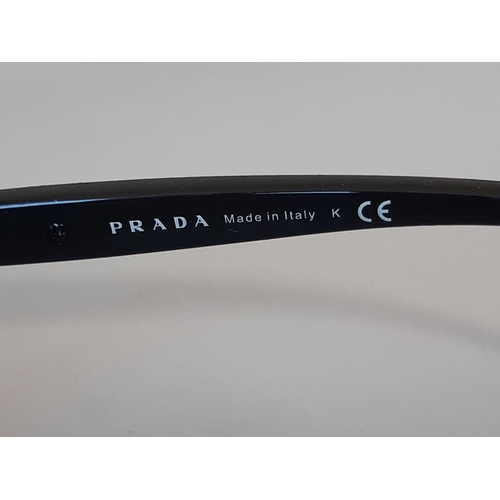 1622 - One pair ladies sunglasses by Prada, unused with original hard case, sealed cleaning cloth and card ... 