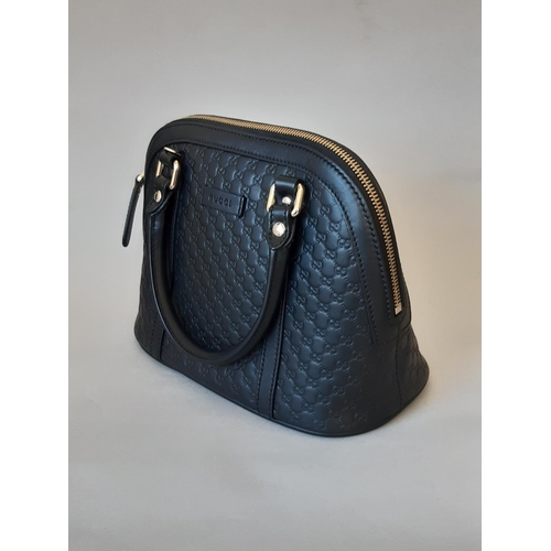 1628 - Gucci ladies handbag in black leather 'Microguccissima Mini Dome' unused, with dual handles, zip clo... 