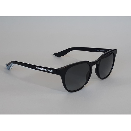 1623 - A pair of mens sunglasses by Christian Dior Homme, appear unused, with envelope style case in black ... 