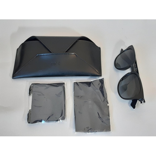 1623 - A pair of mens sunglasses by Christian Dior Homme, appear unused, with envelope style case in black ... 