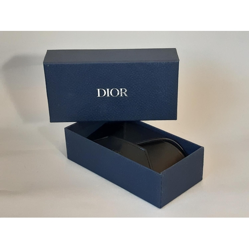 1623 - A pair of mens sunglasses by Christian Dior Homme, appear unused, with envelope style case in black ... 