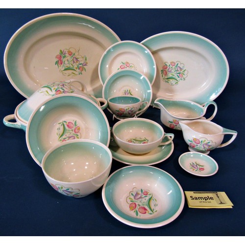 1095 - A collection of Susie Cooper Dresden table wares to include serving plates, graduated plates, soup b... 