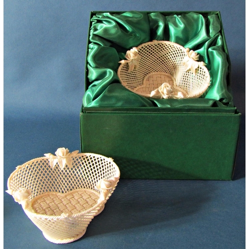 1027 - A pair of Belleek lattice work trefoil shaped baskets, the bases with woven detail, encrusted with r... 