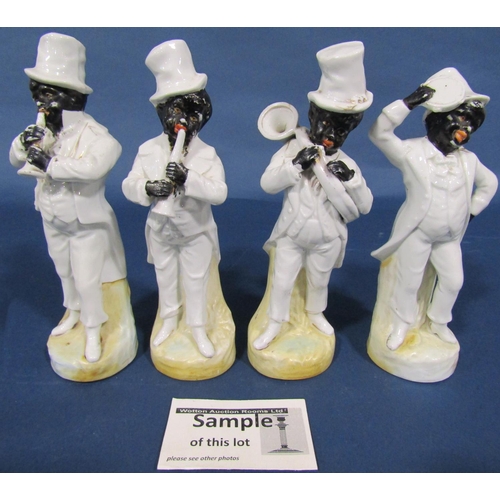 1032 - A set of four American musicians, Staffordshire figure of Uncle Tom, a further Staffordshire figure ... 