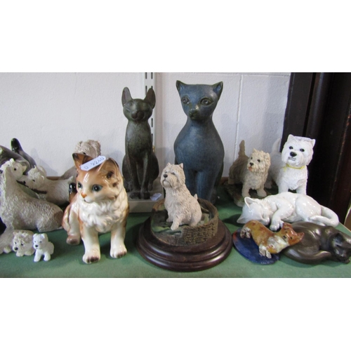 1090 - A large collection of whimsical cats and dogs including a Winstanley cat, three Doulton figures, Wad... 