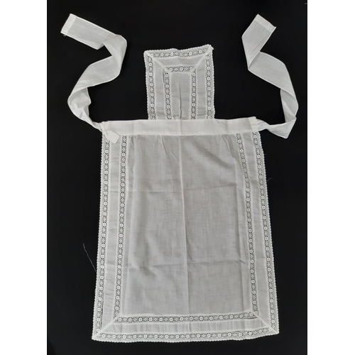 1613 - Circa 1920's household textiles comprising 3 maid's aprons,  an apron in beige starched organza with... 