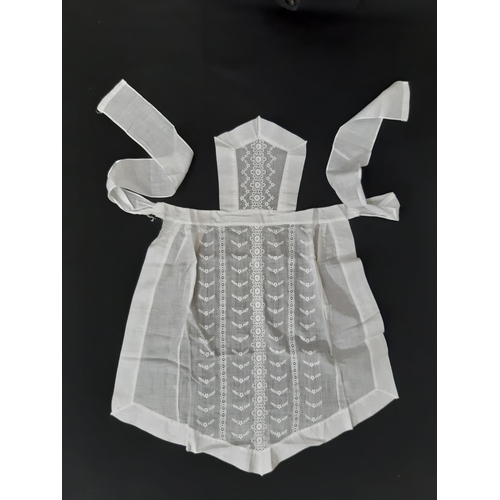 1613 - Circa 1920's household textiles comprising 3 maid's aprons,  an apron in beige starched organza with... 