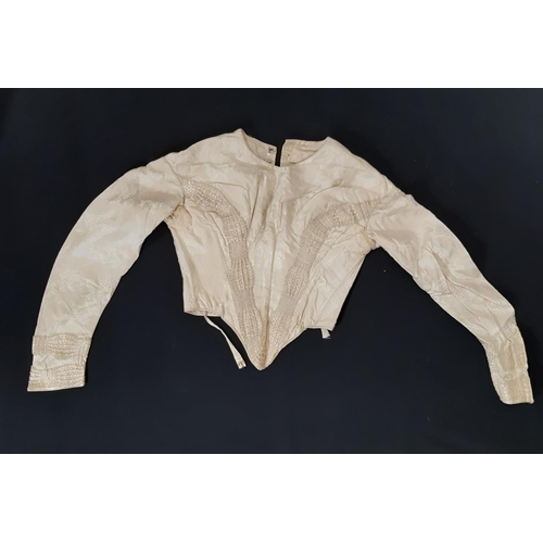 1615 - Four late 19th/ early 20th century garments including the following; full length ivory silk dress wi... 