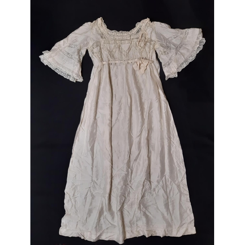 1615 - Four late 19th/ early 20th century garments including the following; full length ivory silk dress wi... 