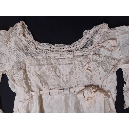 1615 - Four late 19th/ early 20th century garments including the following; full length ivory silk dress wi... 