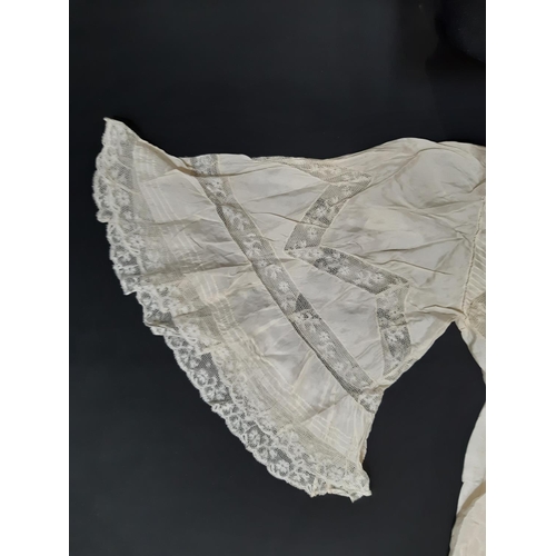 1615 - Four late 19th/ early 20th century garments including the following; full length ivory silk dress wi... 