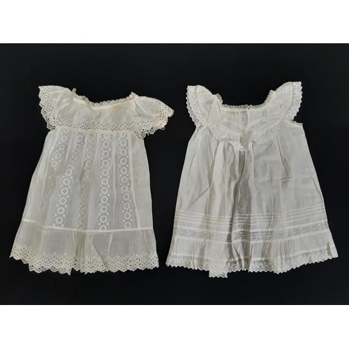 1605 - Eight late 19th/ early 20th century good quality baby gowns, with various designs of lacework, brode... 