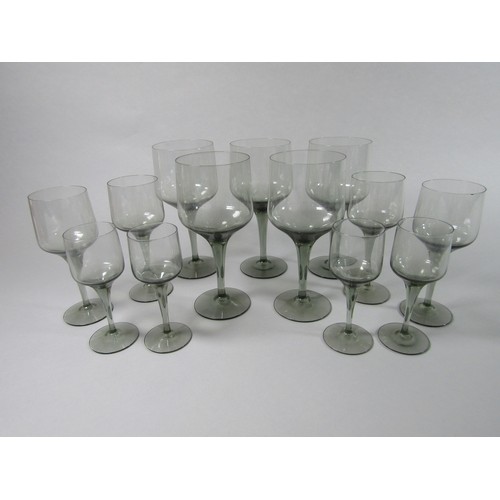 1147 - A collection of Orrefors Rhapsody Smoky grey wine glasses, eleven small wines, 17cm tall, five clare... 