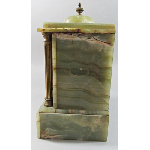 1495 - A late 19th century onyx mantel clock of classical form with brass supports enclosing an eight day s... 