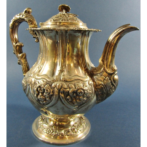 1211 - A Georgian silver teapot with floral engraved decoration, London 1825, maker Joseph Angell I, 27cm h... 