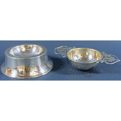 1214 - A mixed selection of silver consisting of three teaspoons with gold clubs, a tea strainer on a later... 