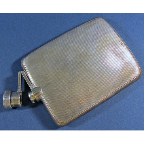 1224 - A silver Engine turned flat hip flask with a screw top lever stopper, 9cm long, to hold 5/16ths of a... 