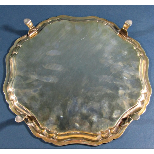 1238 - A silver scalloped edge tray raised on four pad feet, Sheffield 1922, maker Stevenson & Law, 25.5cm ... 