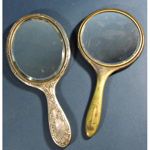 1243 - A silver backed oval hand mirror, Birmingham 1905, maker Deakin & Francis, together with a further s... 