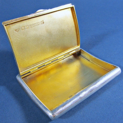 1251 - A Goldsmiths and Silversmiths & Co curved silver cigarette case with gilded interior and a sapphire ... 