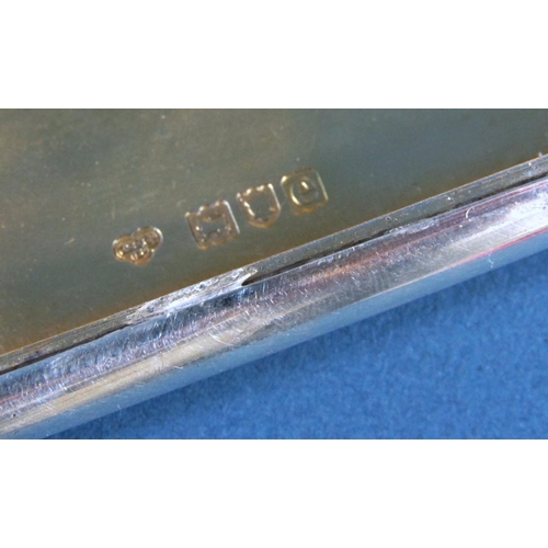 1251 - A Goldsmiths and Silversmiths & Co curved silver cigarette case with gilded interior and a sapphire ... 