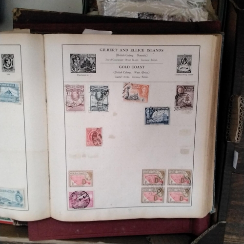 217 - A mixed collection of items to include two stamp albums, loose assorted stamps, FDC's, further small... 